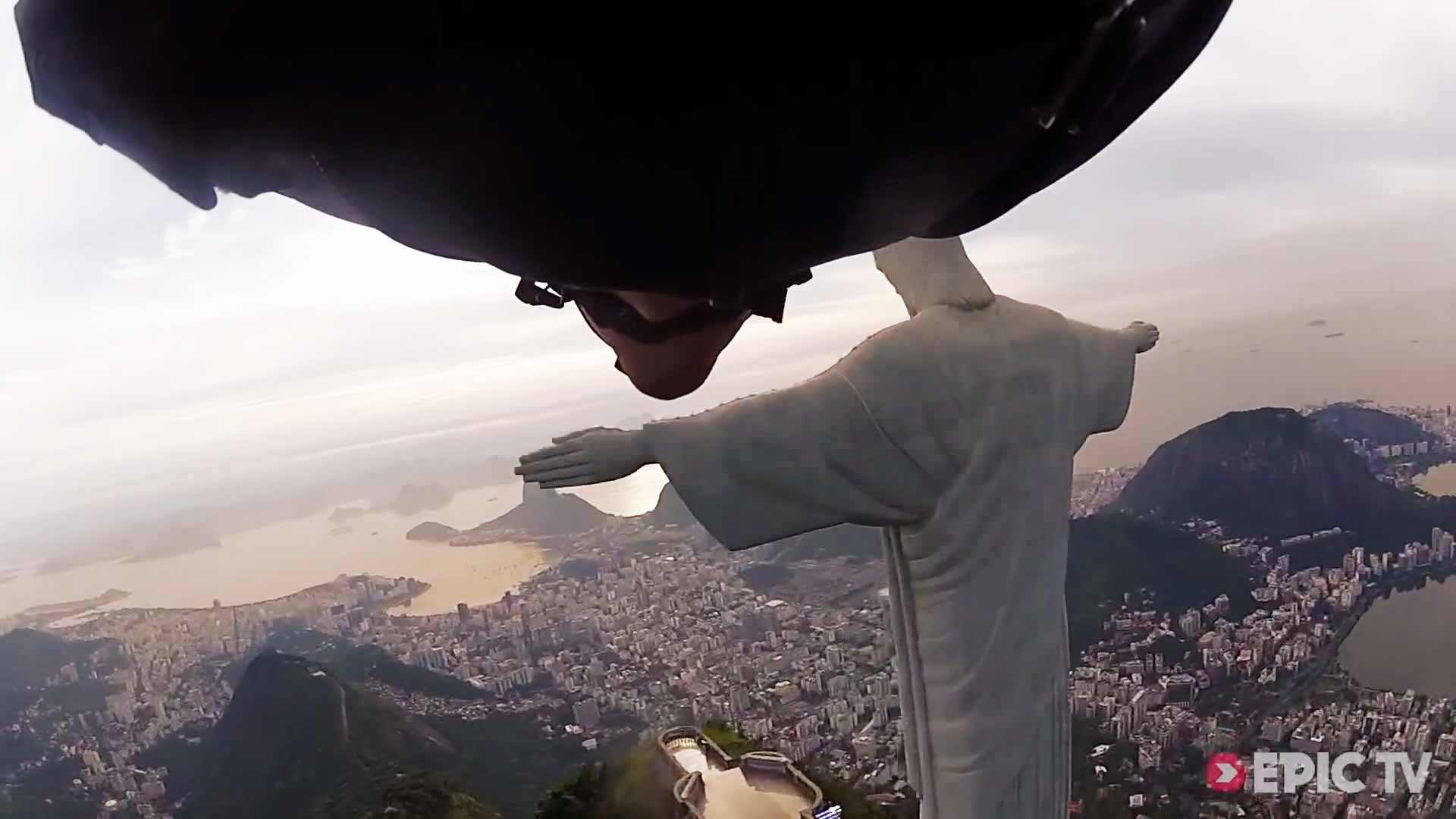 Wingsuit Flight Under Arm Of Christ Statue In Rio De Janeiro